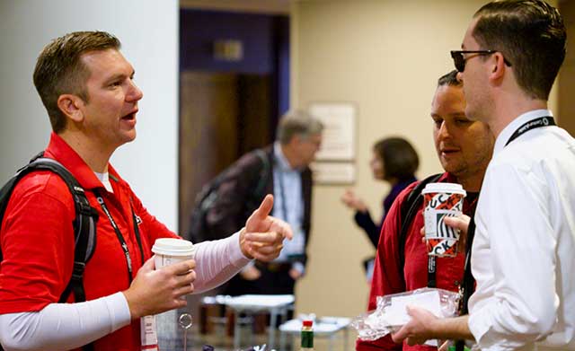 TechEX participants engaging after a presentation.