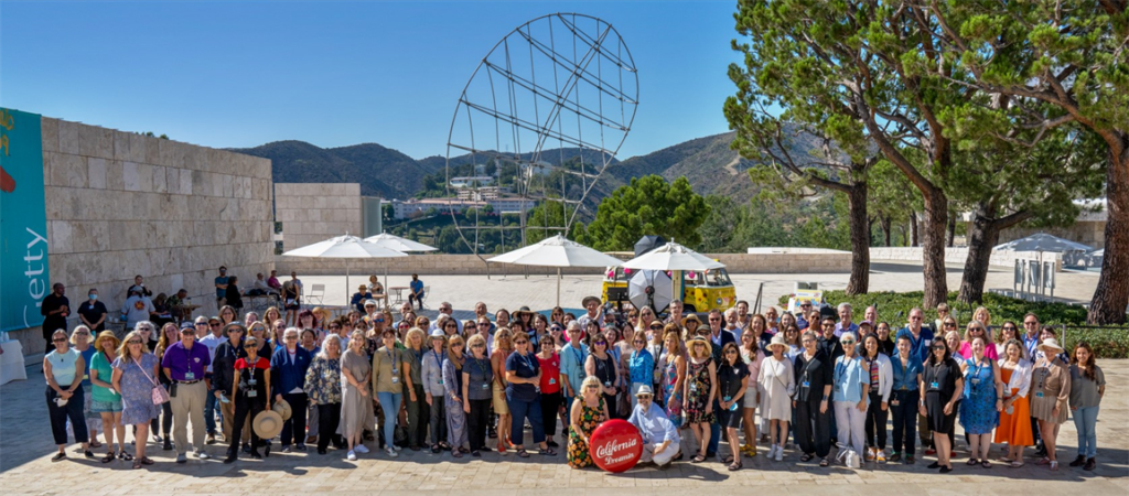 A large group of people taking a photo at the Getty center.