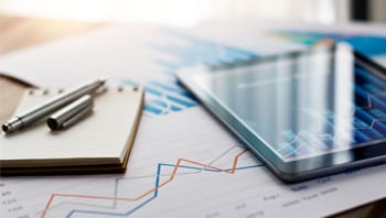 Financial Overview illustration of a notebook, spreadsheet and laptop