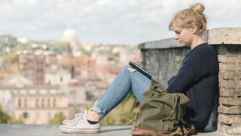 Image of a woman reading her laptop