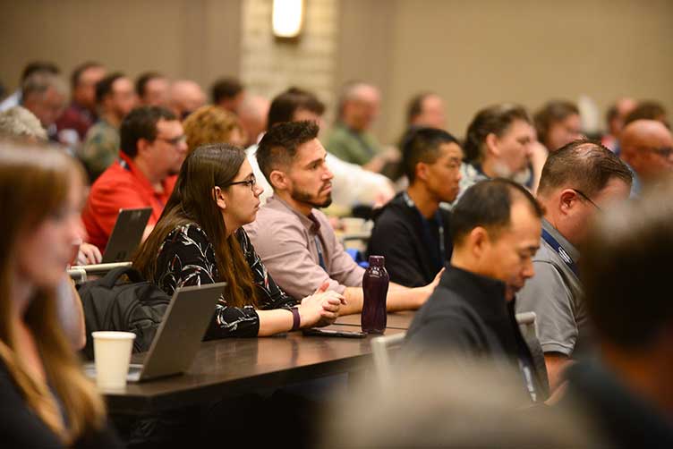 Participants listen to a presentation at an Internet2 conference.